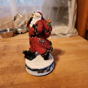 Music box Santa that plays Jingle Bells
